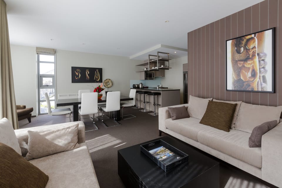 Apartment, 2 Bedrooms | Living area | 55-inch flat-screen TV with cable channels, TV