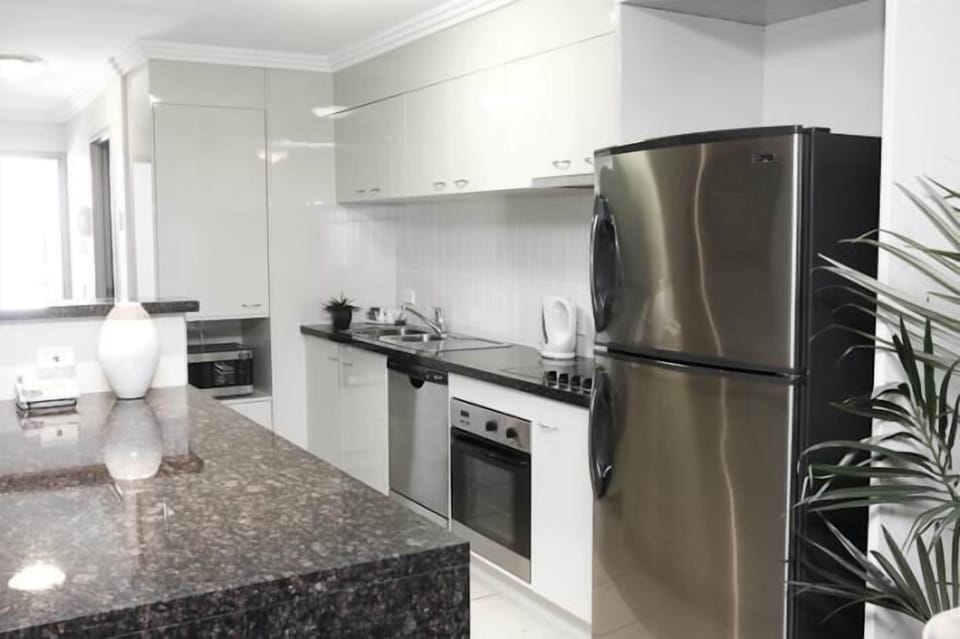 Executive Two Bedroom Ocean Front Apartment | Private kitchen | Coffee/tea maker, full-size fridge, microwave, stovetop
