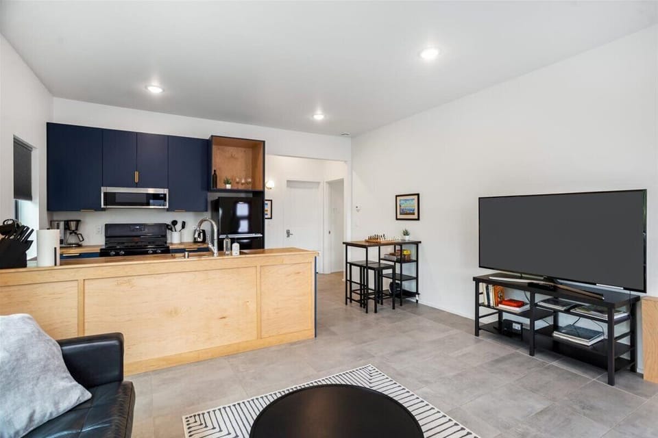 With blackout curtains all around, the suite's living room is the perfect spot to catch up your favorite shows. 