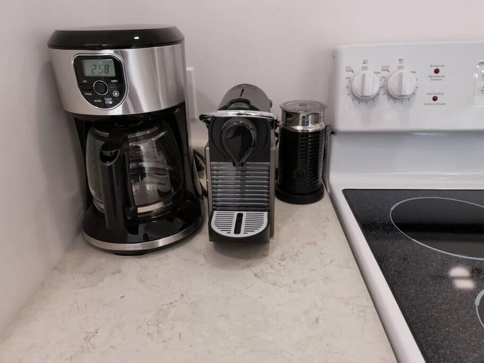 Nespresso and drip coffee machines and coffee provided.