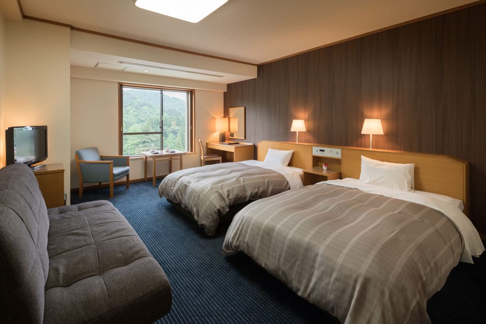 Twin Room, Non Smoking (A) | In-room safe, desk, free WiFi, bed sheets