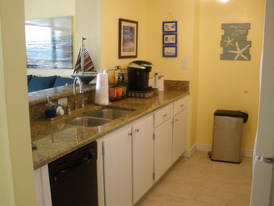 One side of the kitchen. View of the water from kitchen.