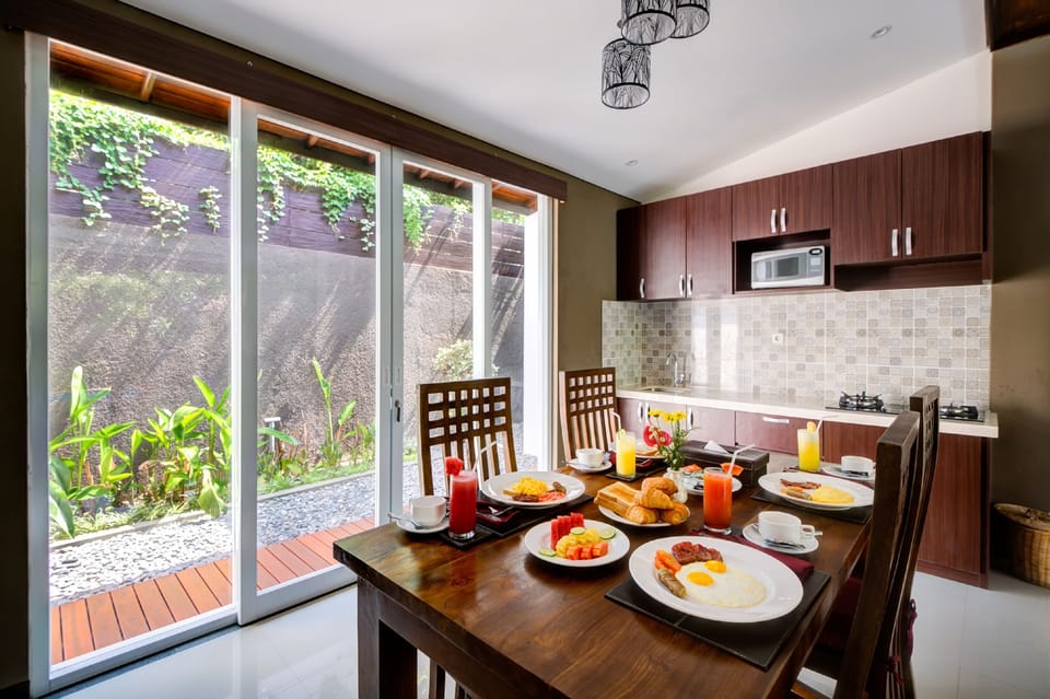 Deluxe Suite | Private kitchen | Full-size fridge, microwave, coffee/tea maker, electric kettle