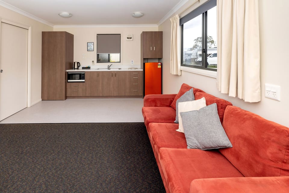 One Bedroom Cabin - Cremorne (Accessible) | Living room | 32-inch LCD TV with digital channels, TV