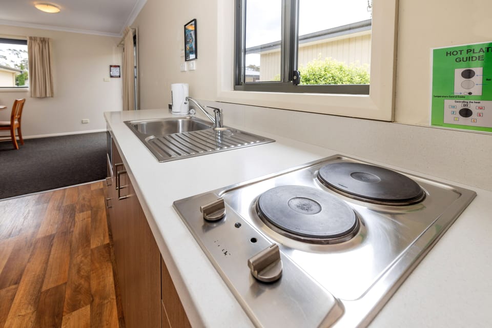 Two Bedroom Cabin - Llanherne | Private kitchen | Full-size fridge, microwave, stovetop, electric kettle