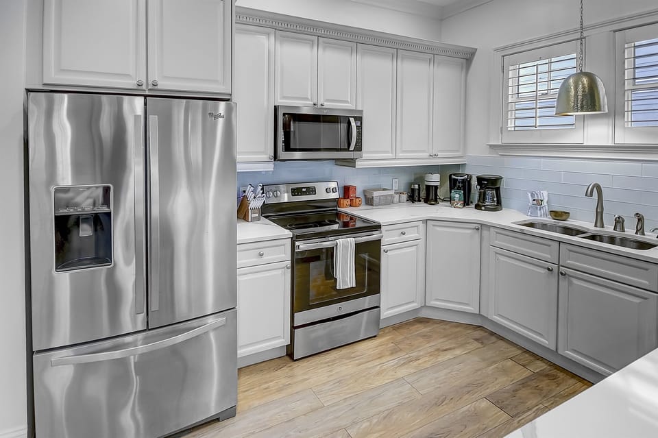 Gourmet Kitchen-Step into our beautiful gourmet kitchen, plenty of natural light and fully stocked with vacation essentials. Stainless steel appliances amidst the coastal design and plenty of kitchenware to meet your needs.