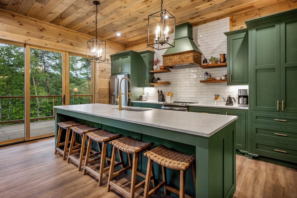 Bold green cabinetry and an amazing view. Forest Ridge Lodge has a fully stocked kitchen