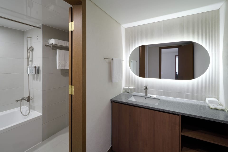 Twin Suite(2 semi double beds), Non Smoking | Bathroom | Combined shower/tub, deep soaking tub, rainfall showerhead