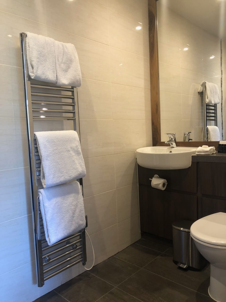 Shower, designer toiletries, hair dryer, towels