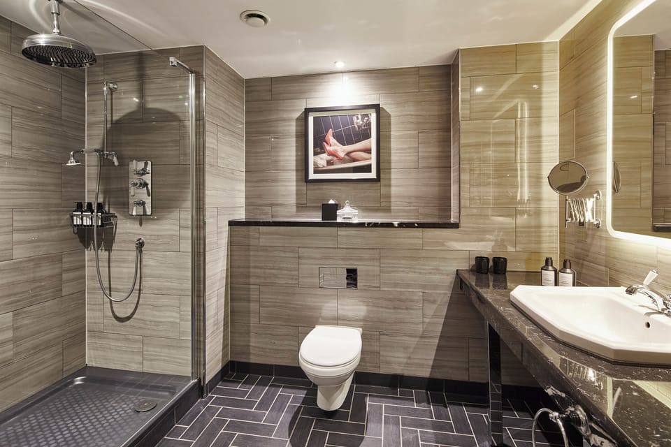 Shower, rainfall showerhead, designer toiletries, hair dryer