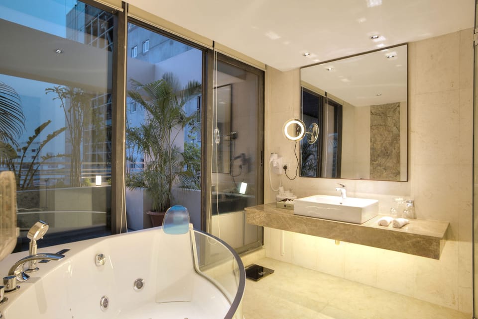 Separate tub and shower, free toiletries, hair dryer, slippers