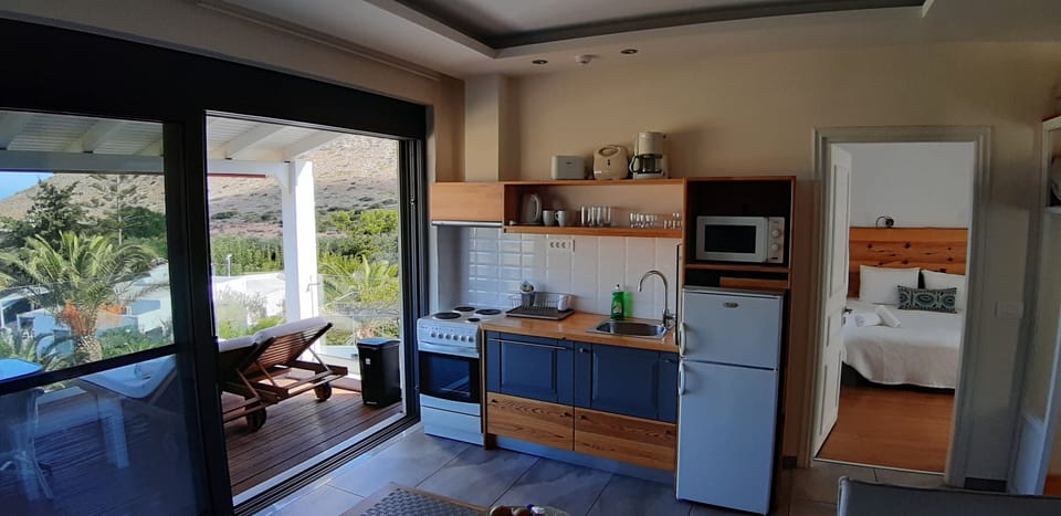 Suite, 1 Bedroom, Sea View (Louiza) | Private kitchen | Full-size fridge, microwave, oven, stovetop