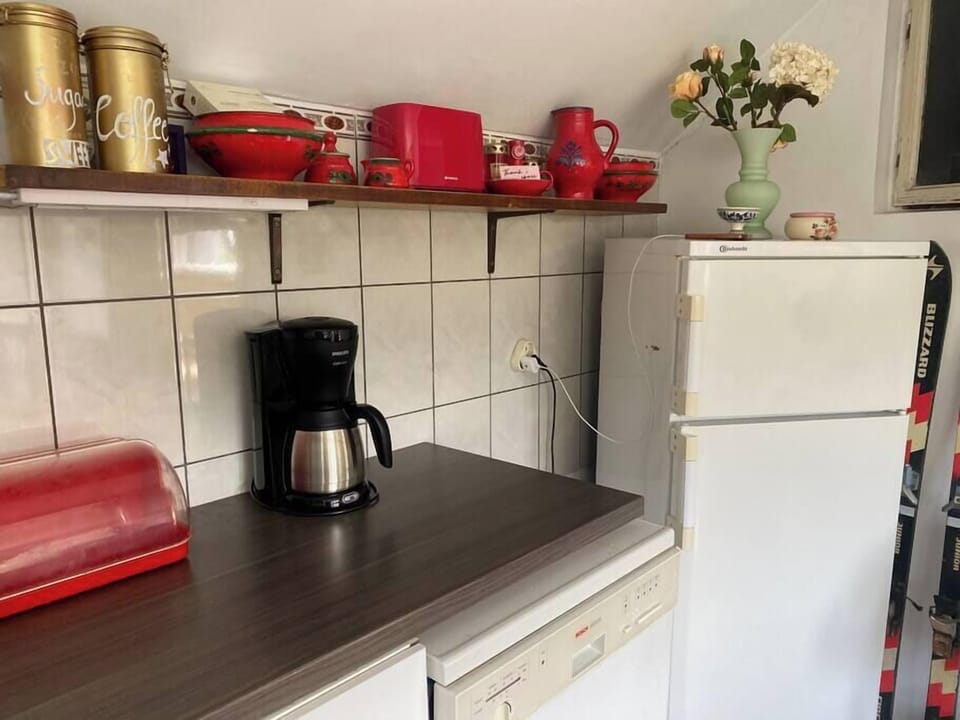 Well equipped kitchen with refrigerator, toaster and coffee machine 