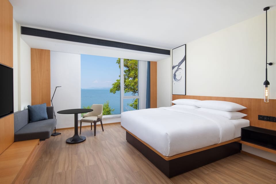 Suite, 1 King Bed, Garden View | Down comforters, in-room safe, desk, laptop workspace