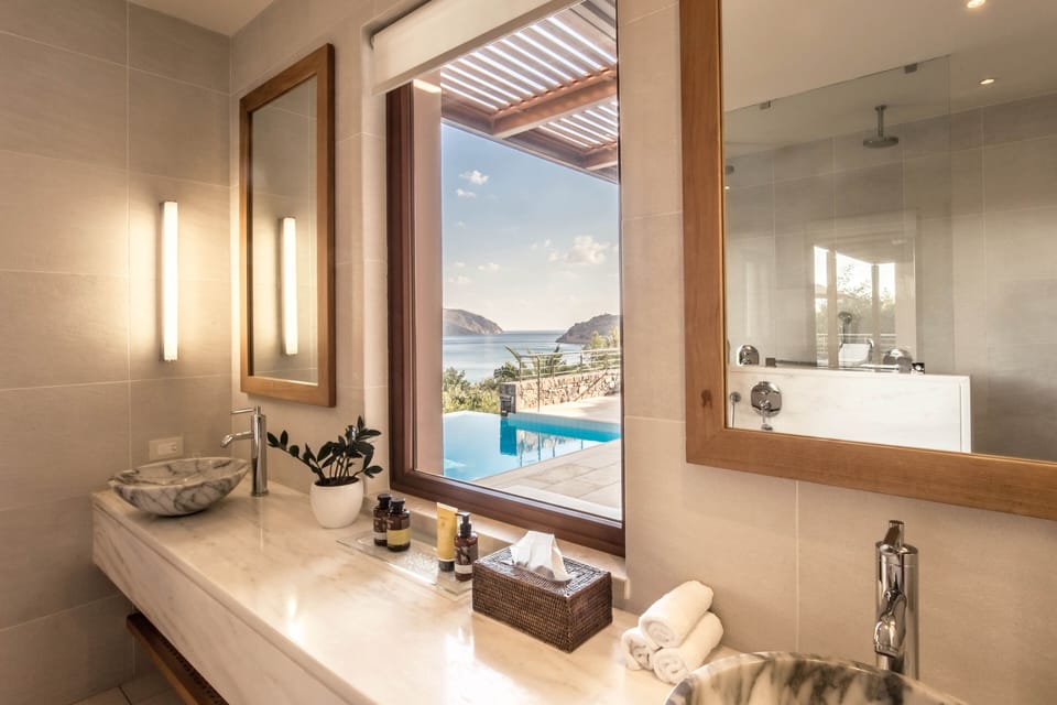 Suite, Sea View (Island, Private Heated Pool) | Bathroom | Eco-friendly toiletries, hair dryer, bathrobes, slippers