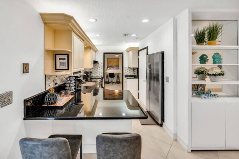 Spacious kitchen featuring a breakfast bar and plenty of counter space.
