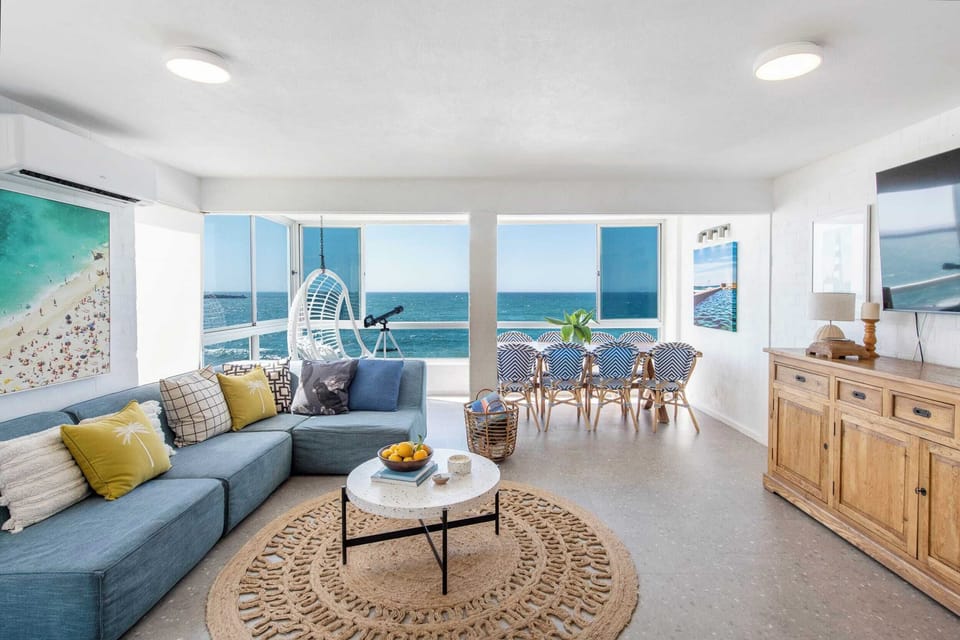 Absolute Oceanfront - Yamba Accommodation - Air-conditioned open plan kitchen, living & dining room with ocean views.