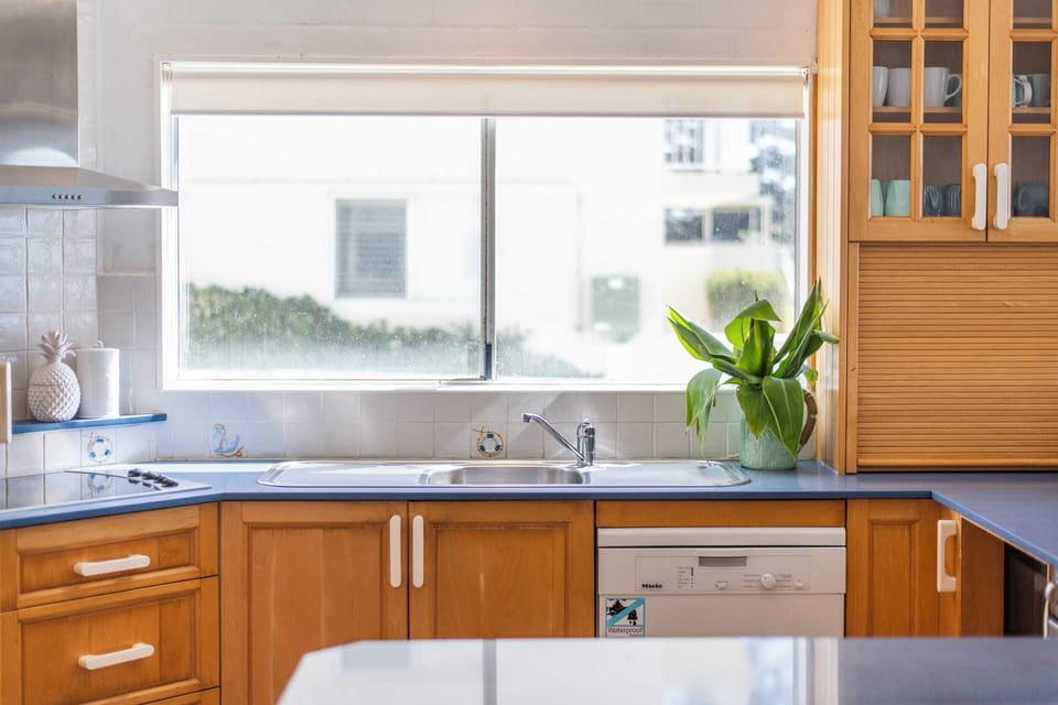 Absolute Oceanfront - Yamba Accommodation - Fully equipped air-conditioned kitchen with ocean views.
