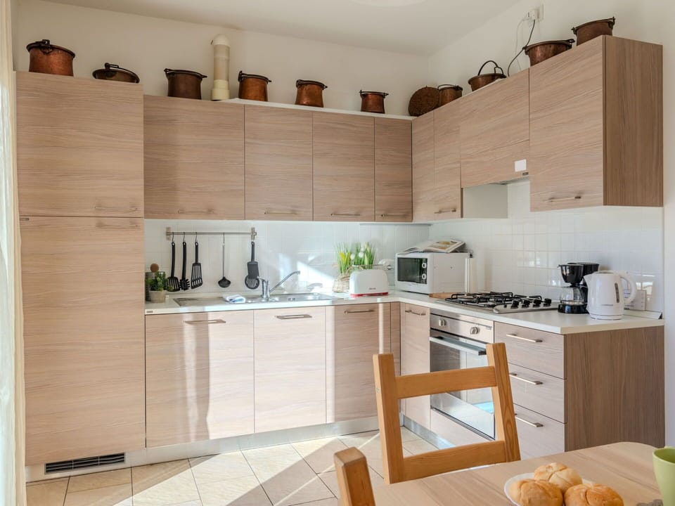 Property, Countertop, Cabinetry, Kitchen Appliance, Kitchen, Kitchen Stove, Home Appliance, Wood, Interior Design, Flooring