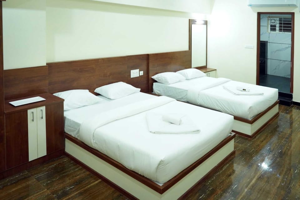 Deluxe Quadruple Room | Select Comfort beds, desk, WiFi (free), bed sheets