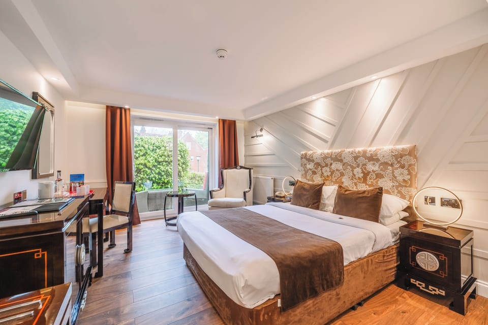 Standard Double Room with Patio | In-room safe, iron/ironing board, bed sheets