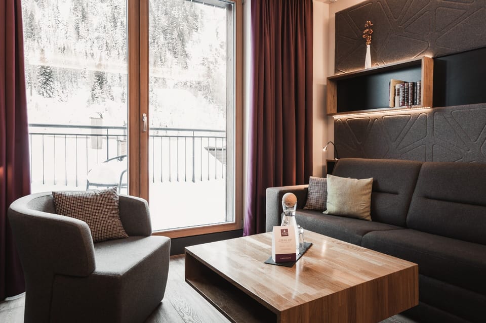 Suite, Balcony, Mountain View | Living area | Flat-screen TV