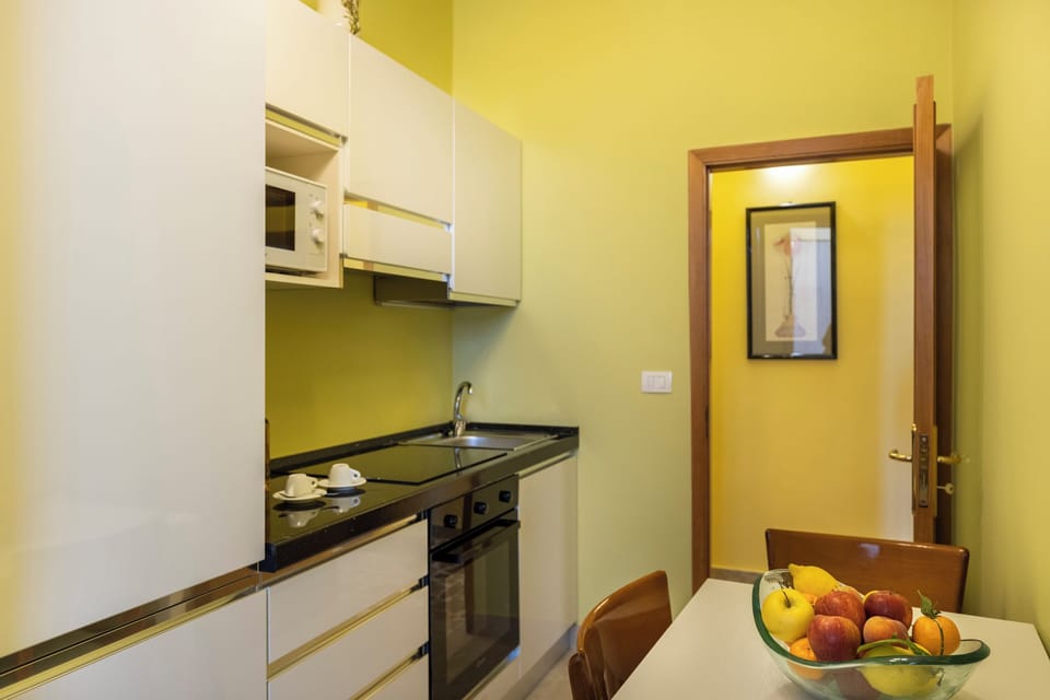 Deluxe Apartment (Minerva) | Private kitchen | Full-size fridge, microwave, stovetop, espresso maker