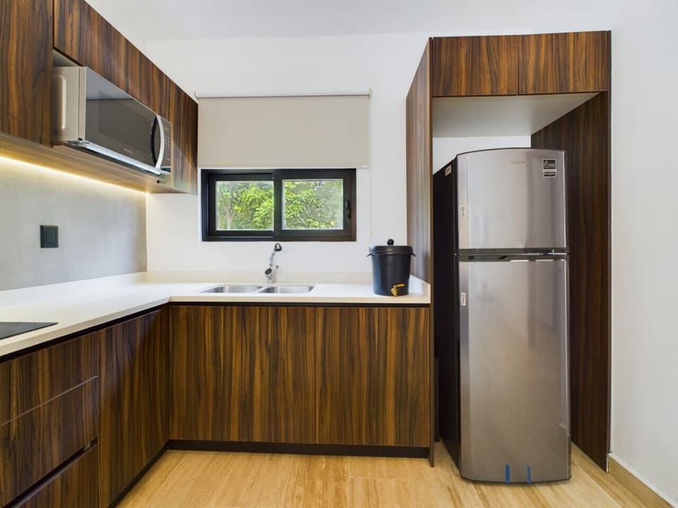 Discover a beautiful modern kitchen that boasts a minimalist design, ideal for crafting culinary delights with style and convenience at your fingertips.