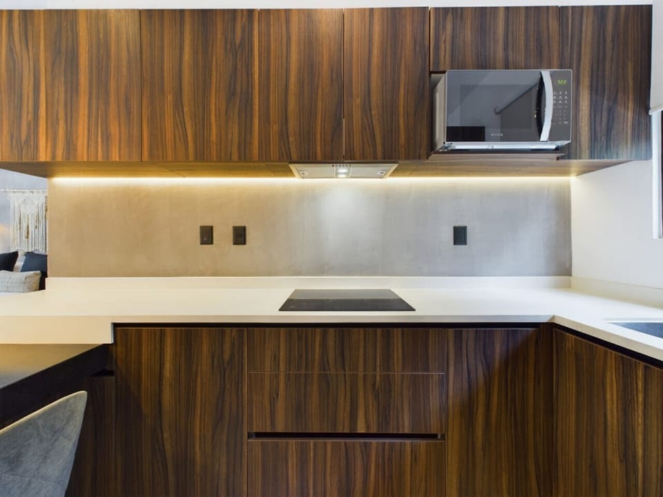 Enjoy cooking in our stylish contemporary kitchen, equipped with all necessary appliances to enhance your culinary experience while enjoying every moment.