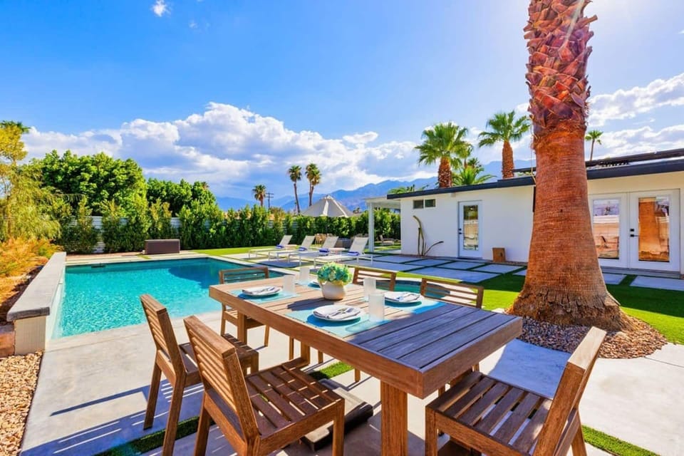 Enjoy meals in the inviting outdoor dining area, perfect for relaxing and gathering.
