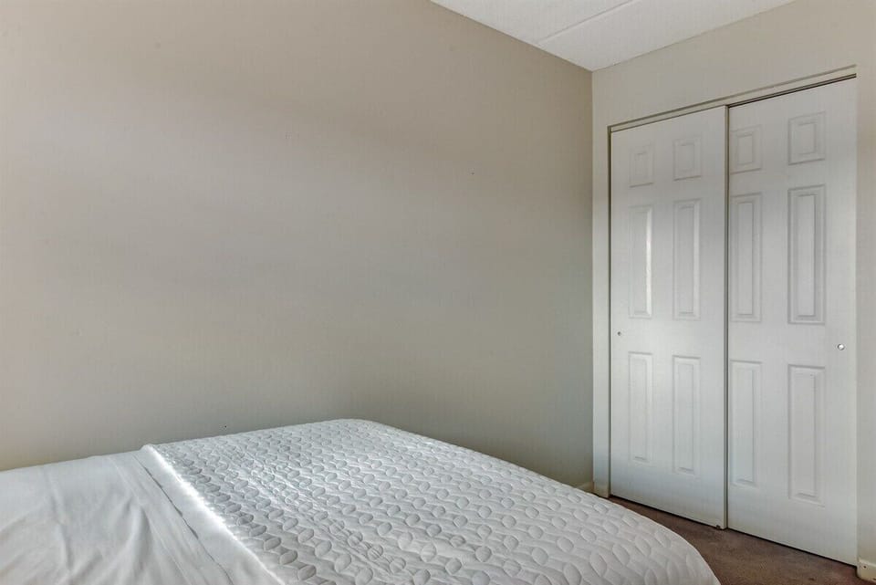 Guest Bedroom has Closet and Hangers for Storage