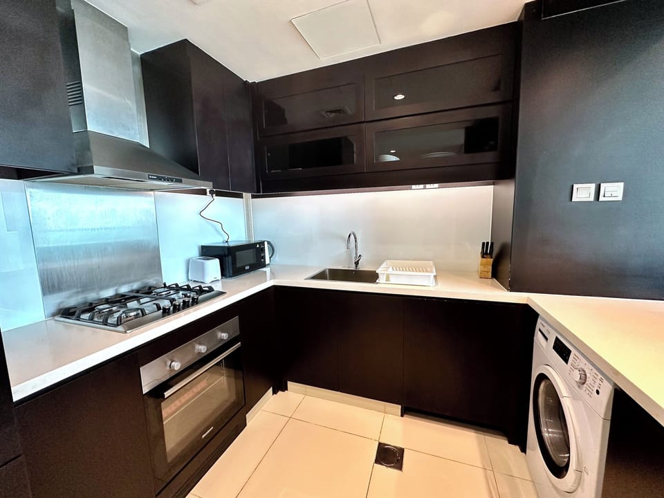 Panoramic Apartment | Private kitchen | Full-size fridge, microwave, oven, stovetop