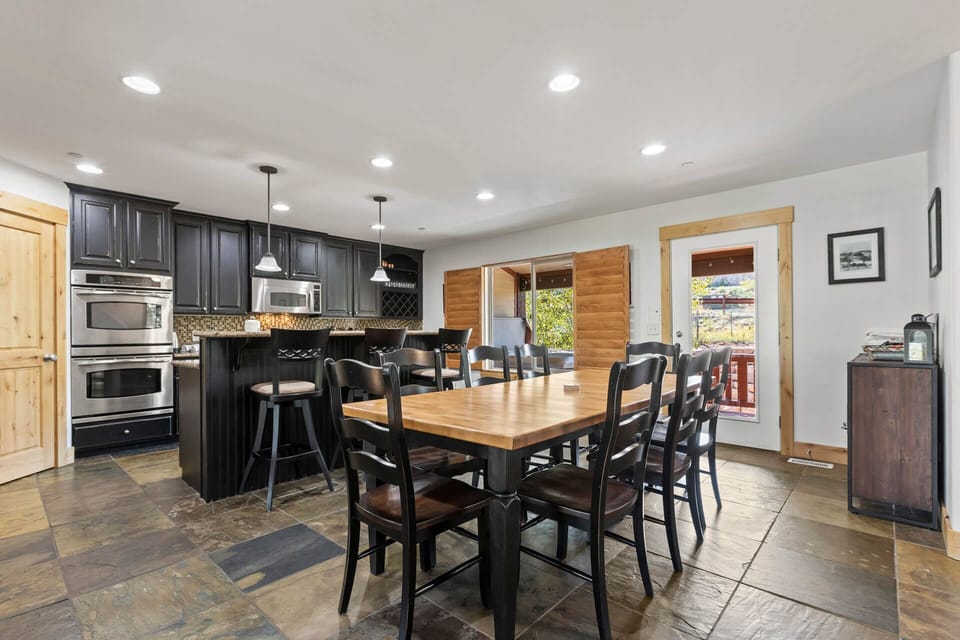 Bear Hollow Village 5595: Dining Area: "Chic dining table with sleek bar stools on a glossy table top."