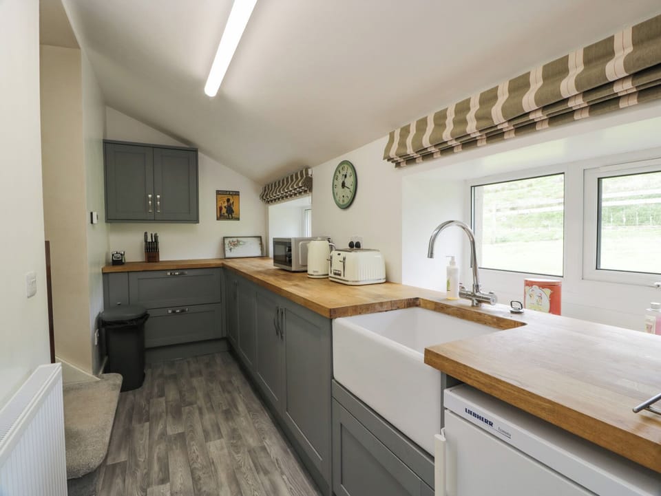 Fridge, electric kettle, toaster, cookware/dishes/utensils