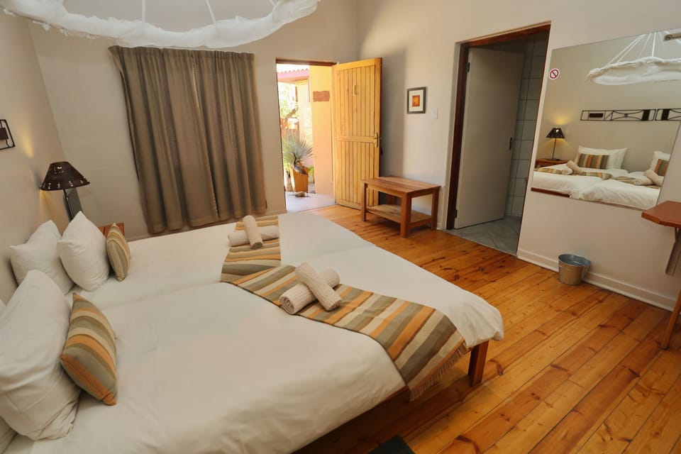 Wheelchair friendly room | Desk, bed sheets