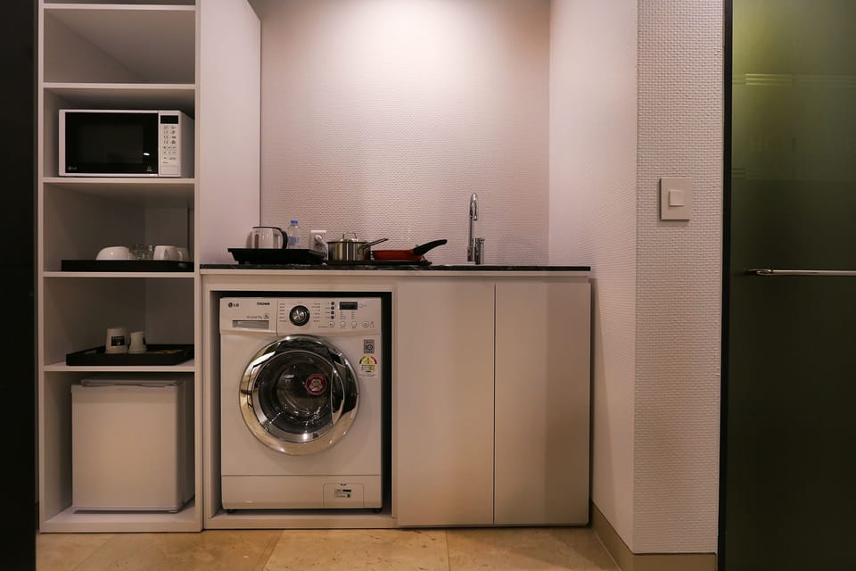 Deluxe Double Room, Kitchen (Residence) | Laundry room