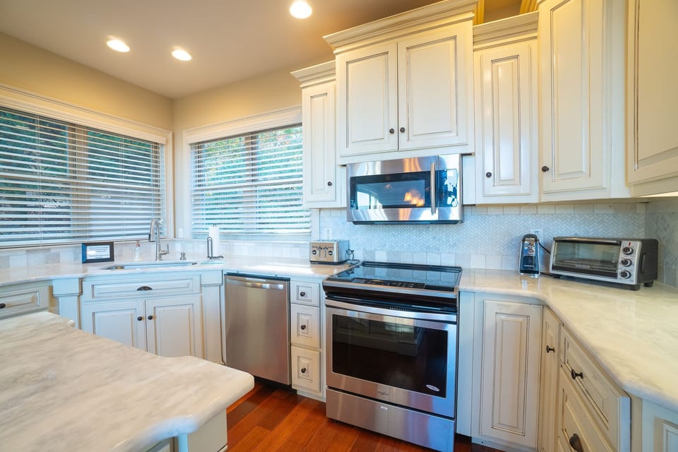 Kitchen with Kuerig coffee maker, toaster, toaster oven, etc