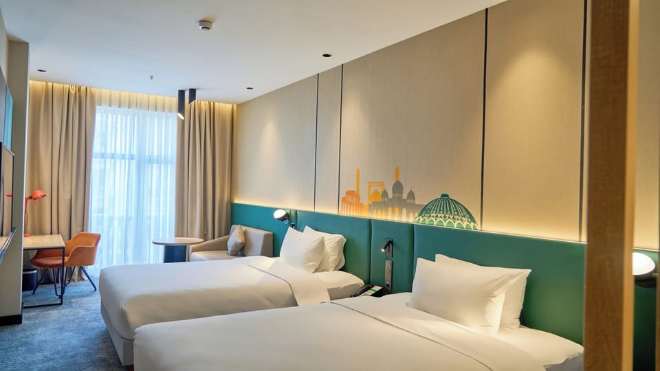 Hypo-allergenic bedding available, in-room safe, desk, laptop workspace
