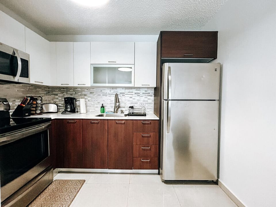 Sleek design and top-notch appliances make this kitchen a dream for any chef.