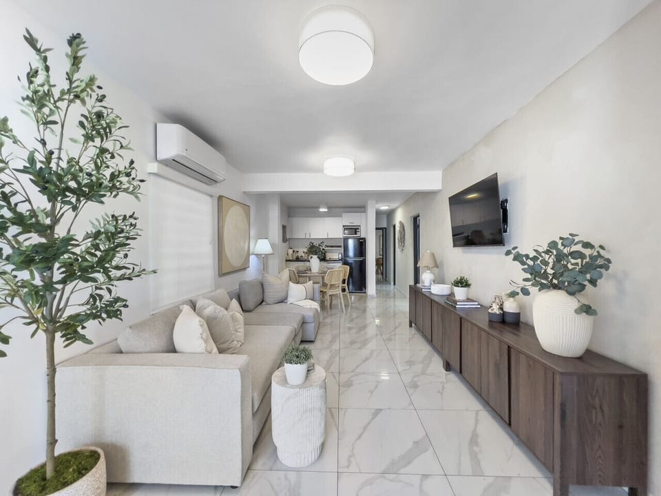 Experience a warm inviting living room created to bring comfort connection and a sense of home