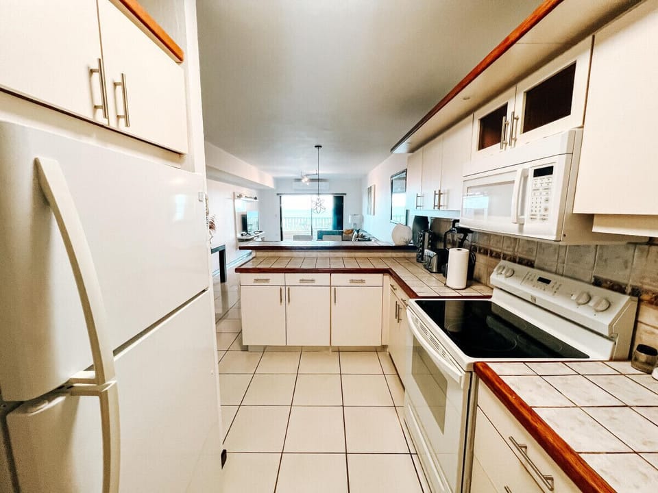 This kitchen combines function with style, featuring plenty of storage, prep space, and top-quality tools for culinary convenience.