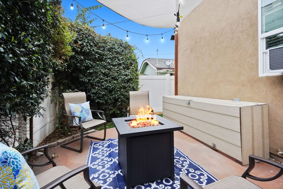 Cozy Patio with Fire Pit and String Lights