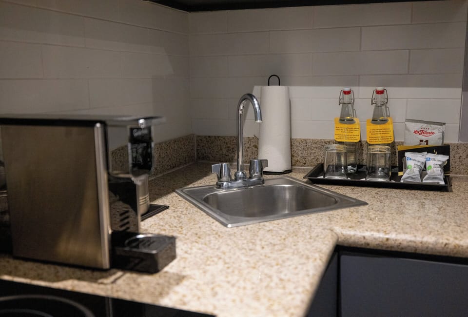 Fridge, microwave, coffee/tea maker, cookware/dishes/utensils