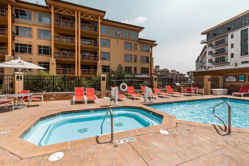 Outdoor heated pool with hot tub