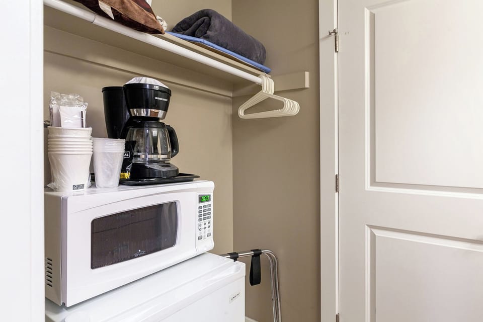 Microwave, mini fridge, and drip coffee maker