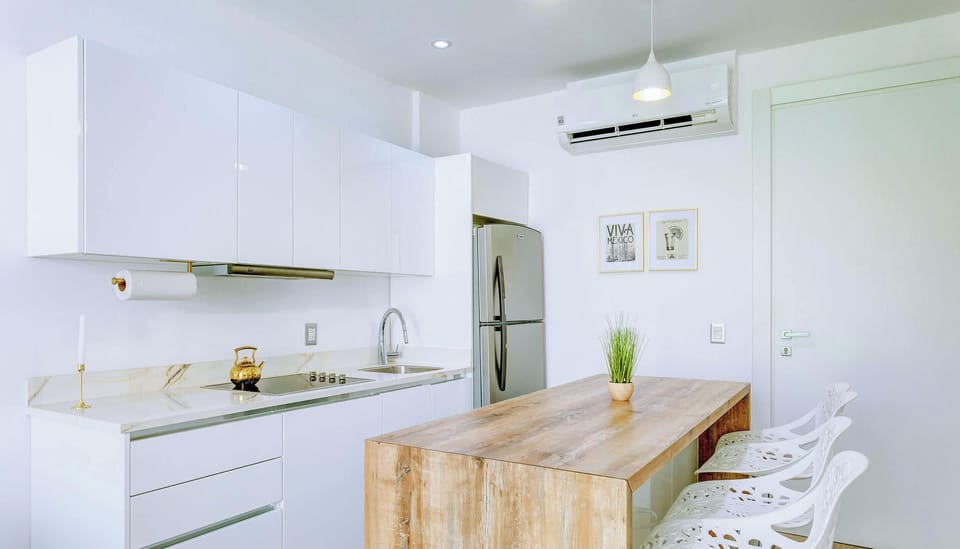 A kitchen with quality appliances and all you’d need to prepare meals at home