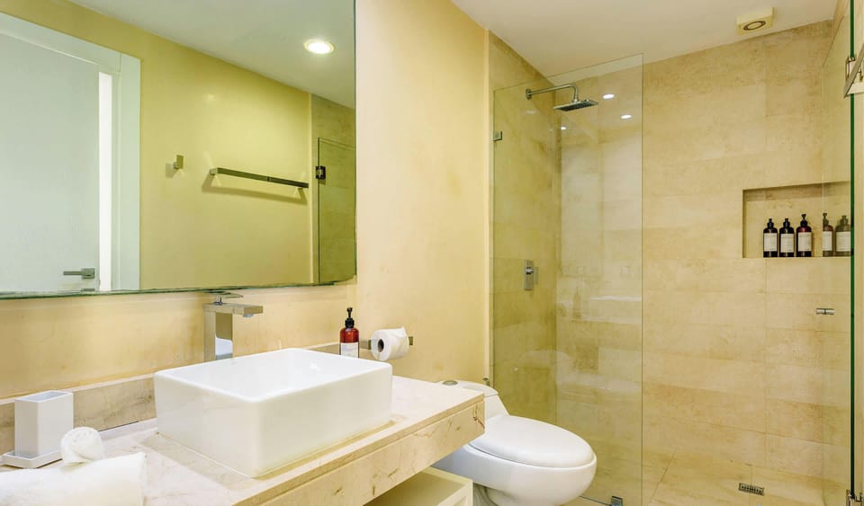 A modern full bath with a walk-in shower
