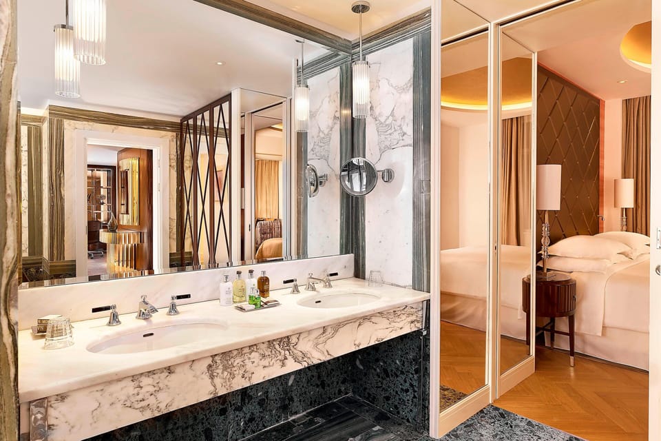 Grand Suite, 1 Bedroom | Bathroom | Combined shower/tub, eco-friendly toiletries, hair dryer, bathrobes