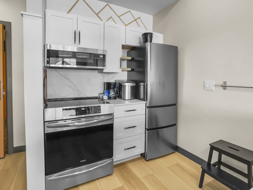 Fully equipped kitchen with stainless steel appliances