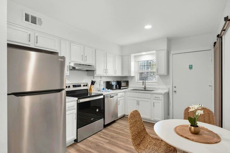 The kitchen is conveniently accessible from the dining area